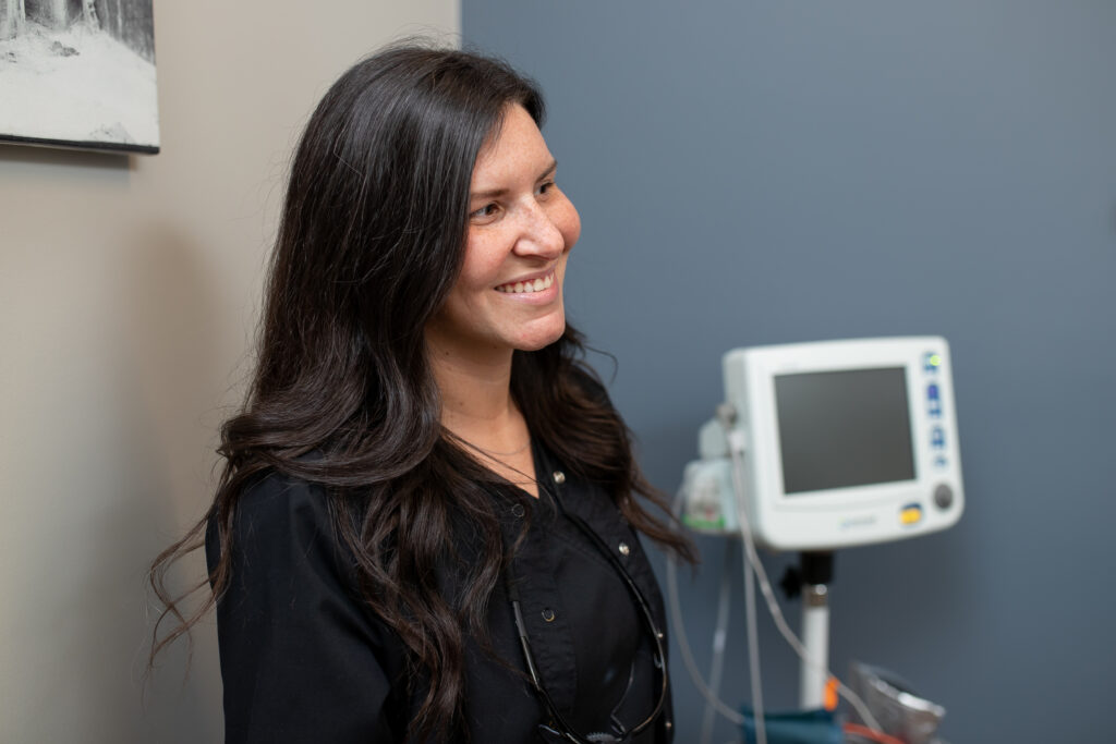 surgical assistant at Desert Valley Oral Surgery smiling