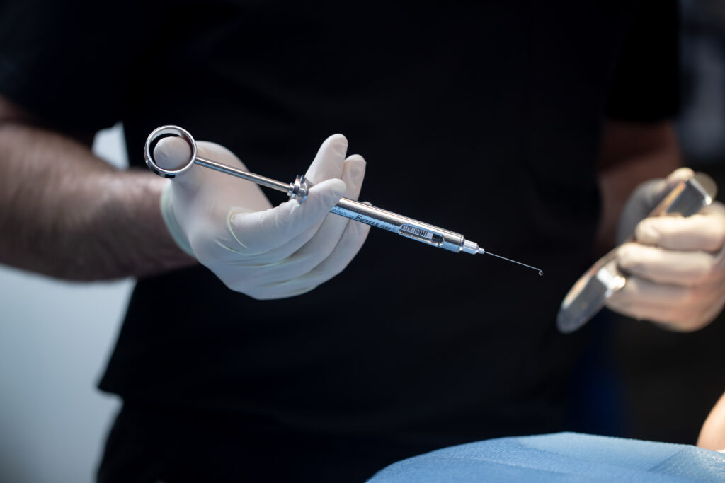 surgical tools in a surgeon's hand