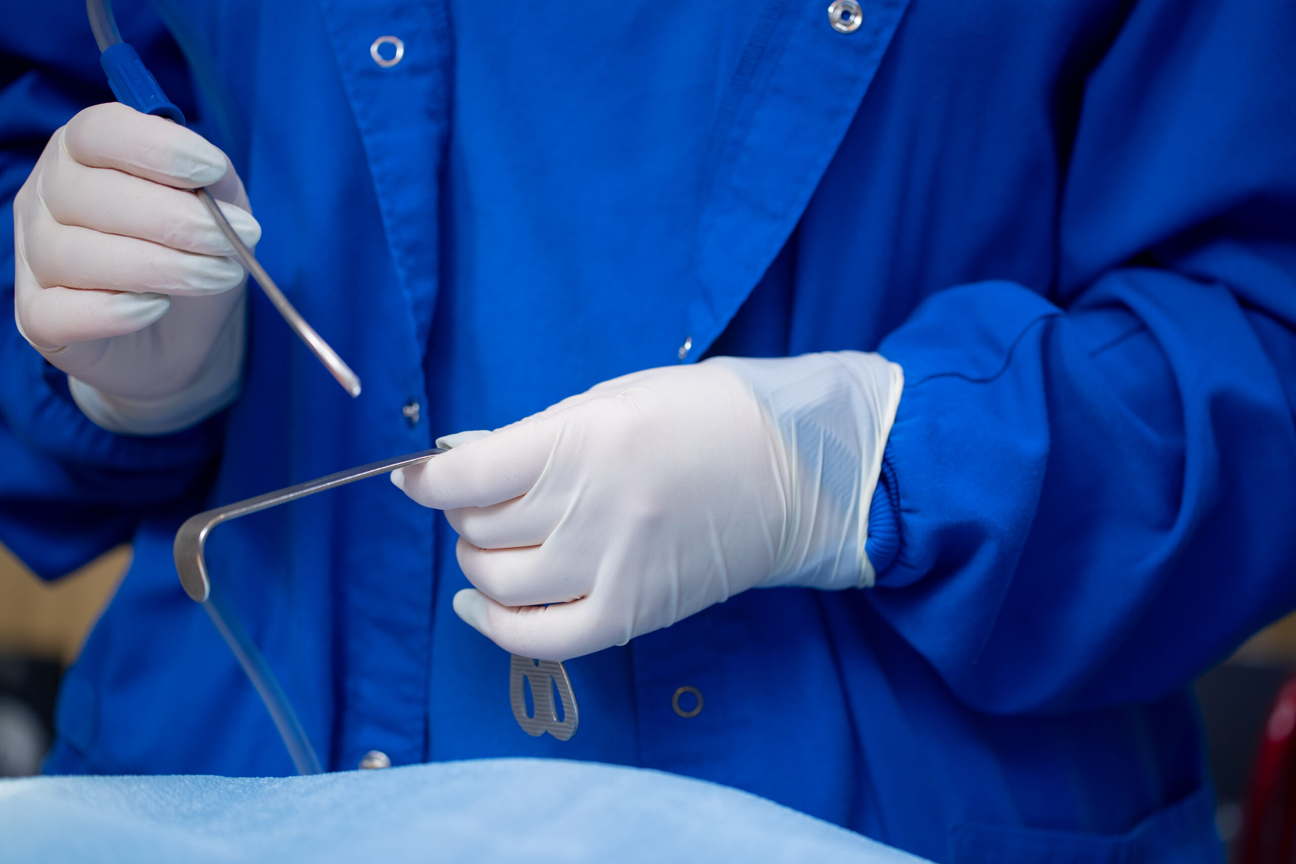 surgeon prepping oral surgery tools